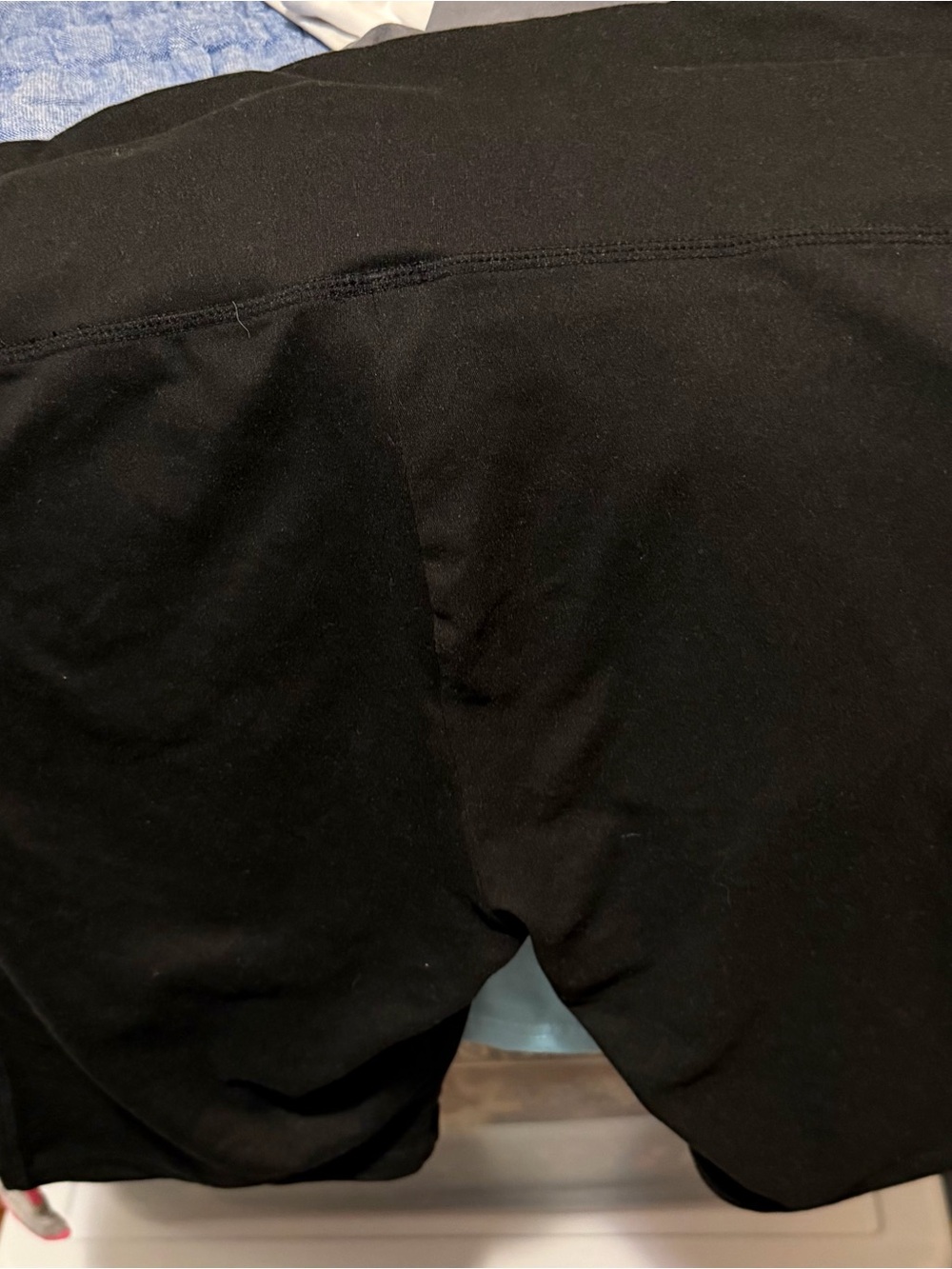 This is a pair of women's high-waisted black athletic bike shorts.